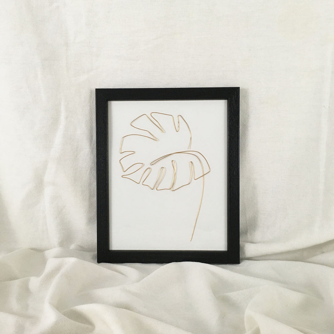 Monstera Wire Art - black frame, gold wire